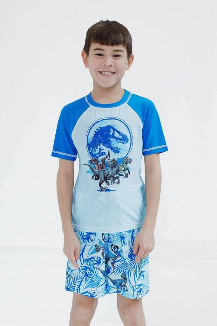 Jurassic World Kids UPF 50+ Sun Protective Swim Shirt & Trunks Set - Dinosaur Themed Rash Guard & Shorts for Boys & Girls (Sizes 4-16)